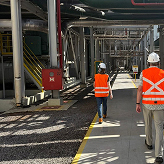 Workers inspecting operations at an industrial plant